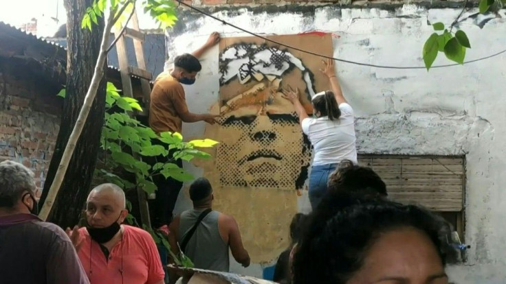 IMAGESPeople gather near Diego Maradona's childhood home in Villa Fiorito in the southern outskirts of Buenos Aires, after the death of the Argentine footballing legend.