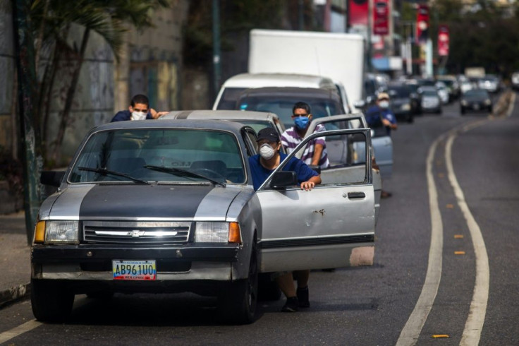 Venezuela's severe gasoline shortage that these Caracas residents endure poses special problems for the vaccine distribution in that crisis-wracked country