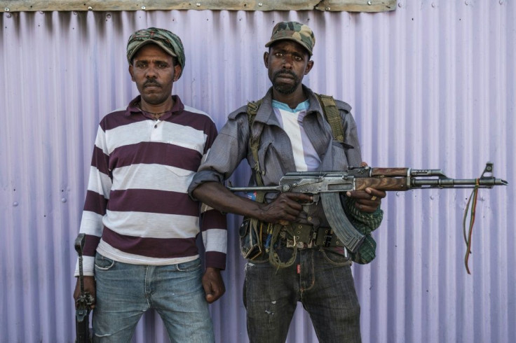 Two members of the Amhara militia in Mai Kadra, where at least 600 civilians were killed, according to Rthiopia's rights watchdog