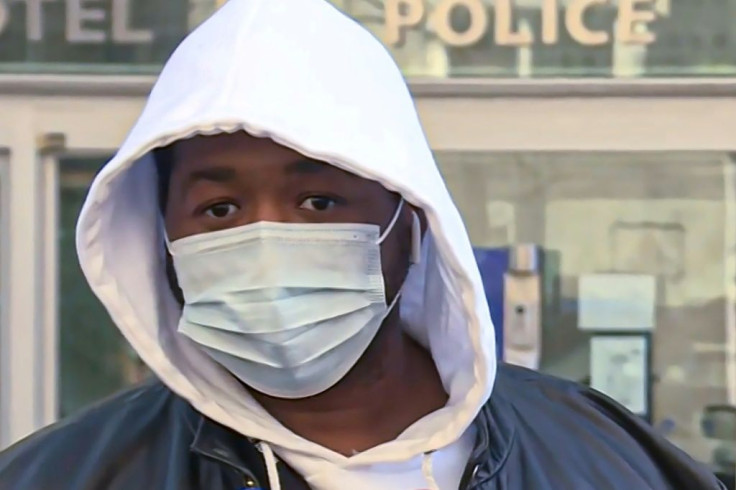 A French music producer, identified only as Michel, talks to the media on Thursday before pressing charges against the police over a repeated beating while trying to enter a studio in Paris last week. Video of the beating has sparked outrage