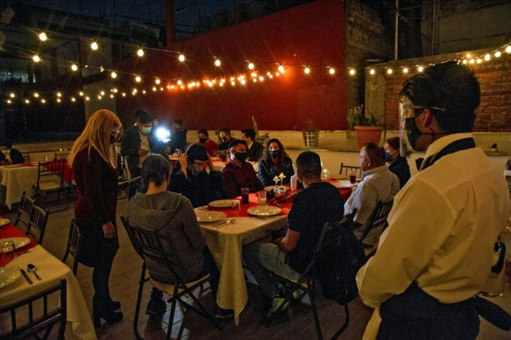 Deported migrants attend the NGO New Comienzos Thanksgiving dinner, in Mexico City, on November 25, 2020