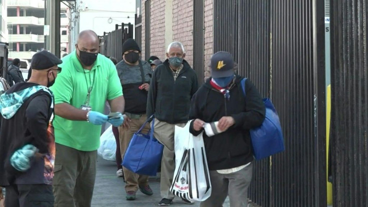Despite the Covid-19 pandemic, the Los Angeles Mission maintains it's annual food distribution to help nourish those struggling to make ends meet this Thanksgiving. "A hot meal, it warms your heart," says one beneficary.