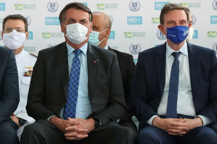 Rio de Janeiro Mayor Marcelo Crivella (R, pictured September 2020) is an Evangelical bishop and an ally of Brazilian president Jair Bolsonaro