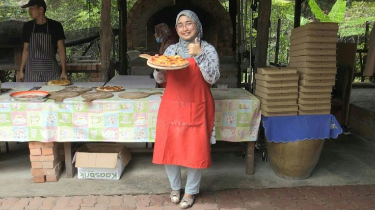 A Malaysian family have cooked up a tasty solution to their economic woes during the pandemic by opening a backyard pizza restaurant that has proved a hit in their sleepy village. Malaysia has largely lifted the toughest of its restrictions and most busin