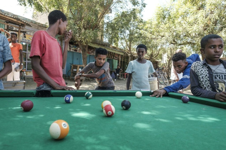 Time for pool: Children try their skills on a Dansha table
