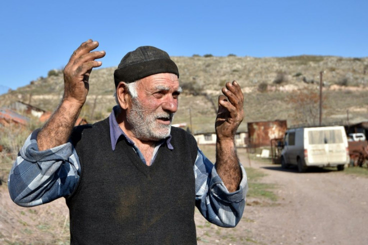 Pomegranate grower Zhorik Grigoryan, 73, nearly lost his pomegranate field in the fighting