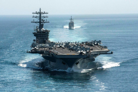 This US Navy handout photo shows the aircraft carrier USS Nimitz and the guided-missile cruiser USS Philippine Sea steaming through the Strait of Hormuz on September 18, 2020