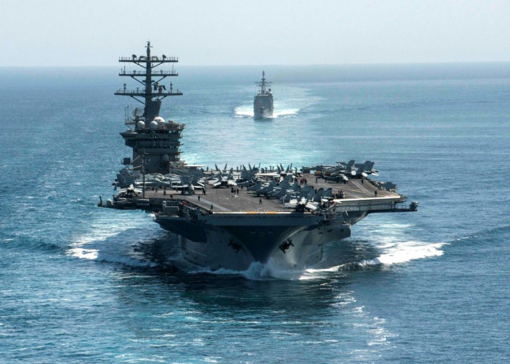 This US Navy handout photo shows the aircraft carrier USS Nimitz and the guided-missile cruiser USS Philippine Sea steaming through the Strait of Hormuz on September 18, 2020