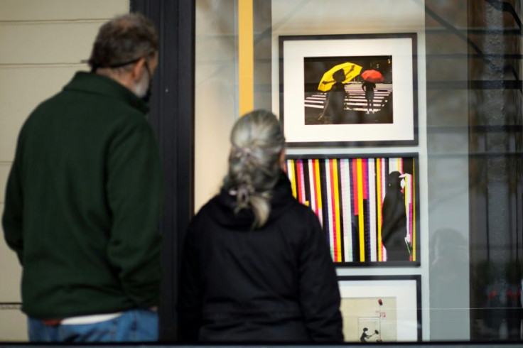 Art, including by artist Kevin Kinner seen here on November 28, 2020, is being displayed in unused retail spaces in the Art on the Ave exhibition in New York
