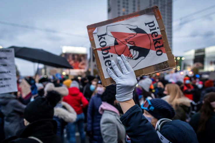 A demonstrator's banner at  a Saturday pro-choice demo reads "Women's Hell"