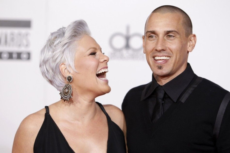 Singer Pink and husband, motocross racer Carey Hart, arrive at the 2010 American Music Awards in Los Angeles November 21, 2010.