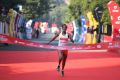 Ethiopian athlete Yalemzerf Yehualaw runs towards the finish line to win the women's 2020 Airtel Delhi half marathon in New Delhi