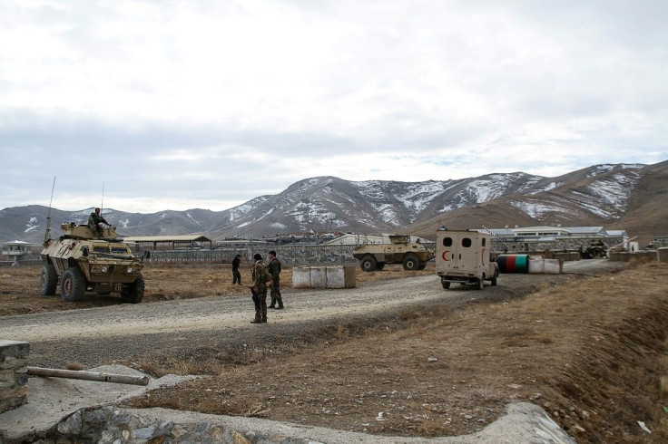 Security personnel near the army base hit by a suicide bomber on the outskirts of Ghazni