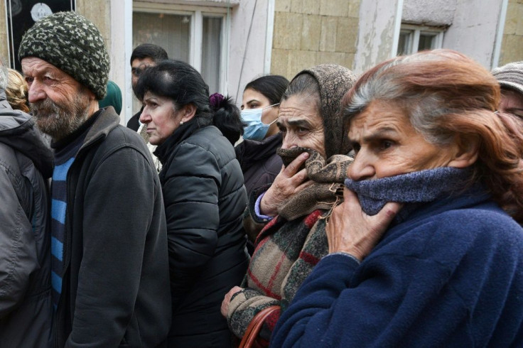 People queue for a food package in Karabakh's main city Stepanakert