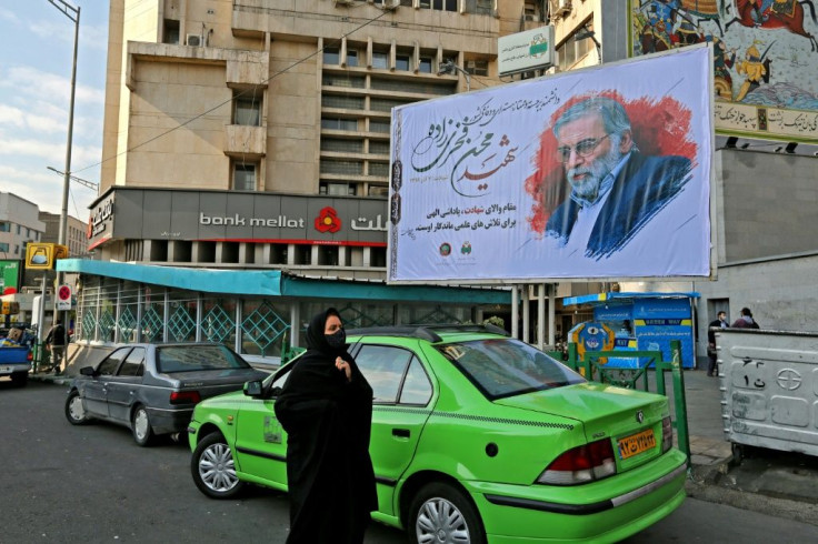 Fakhrizadeh, shown here on a billboard in the capital, did not have a high profile before he was killed, but is now being celebrated as a top "martyr" by the Islamic republic