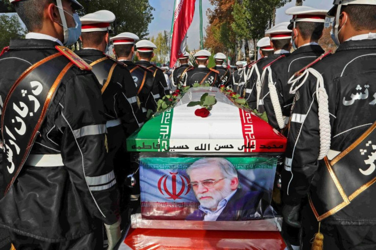 Mohsen Fakhrizadeh's coffin, draped in the Iranian flag and with a photo of the assassinated nuclear scientist