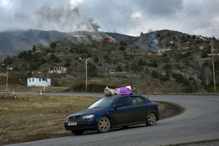 Residents packed up and fled as houses burnt on the outskirts of Lachin town