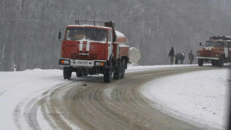 Prodding her cows forward with a long stick, Asya Petrosyan drives the herd along the snow-covered Lachin corridor, the last road out of Nagorno-Karabakh to Armenia. With Azerbaijani forces preparing to take back this district on Tuesday, the 67-year-old 