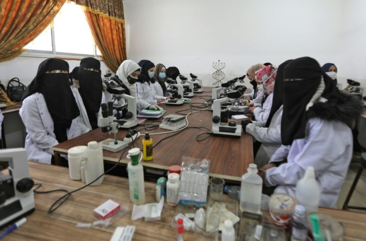 Students attend a class at the "Aleppo University in Liberated Areas" which was founded in 2014, three years after Syria's conflict started