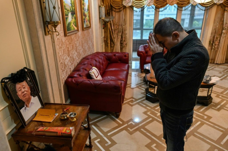 Wuhan native Liu Pei'en shut down his business and converted to Buddhism to try to make sense of his father's death last January from suspected Covid-19