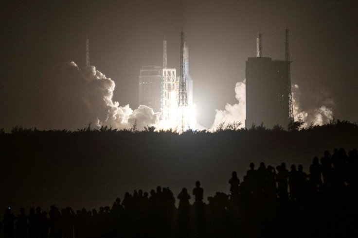 A Long March 5 rocket carrying China's Chang'e-5 lunar probe launches from the Wenchang Space Center on China's southern Hainan Island on November 2020