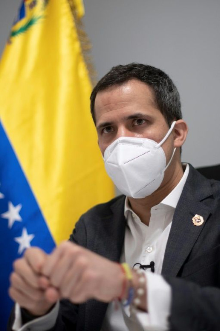 Venezuelan opposition leader Juan Guaido gestures during an interview with AFP at his home in Caracas on November 30, 2020