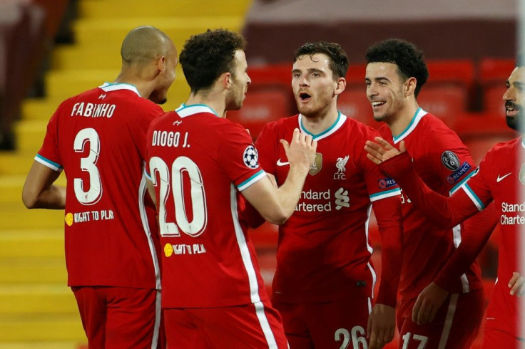 Curtis Jones celebrates with teammates after scoring Liverpool's winner against Ajax