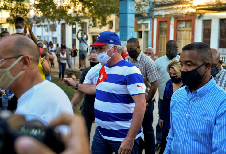 Cuban President Miguel Diaz Canel (C) arrives at a concert rally to condemn the media campaign in support of the San Isidro movement in Havana, on November 29, 2020