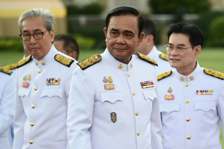 Thailand's constitutional court ruled that Prime Minister Prayut Chan-O-Cha (C) was not guilty of conflict of interest by living in an army residence after leaving the military