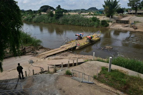 Thai soldiers guard a river crossing between Thailand and Myanmar in the border town of Mae Sot in Tak province in late October
