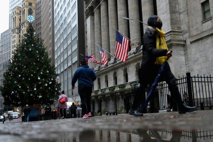 People walk past the New York Stock exchange (NYSE) on Wall Streetin New York City in November 2020: a new bill could close US money and stock markets to Chinese firms soon