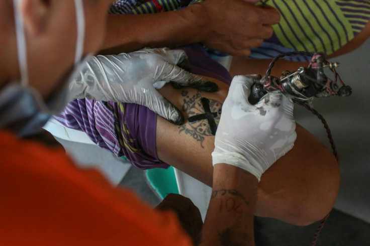 Philippine prisoners are having their gang tattoos covered over, in a move authorities hope will reduce jail violence by weakening solidarity between members