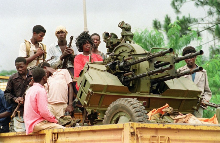 Rebels loyal to warlord Charles Taylor patrol Monrovia's streets in August 1990 during Liberia's first civil war