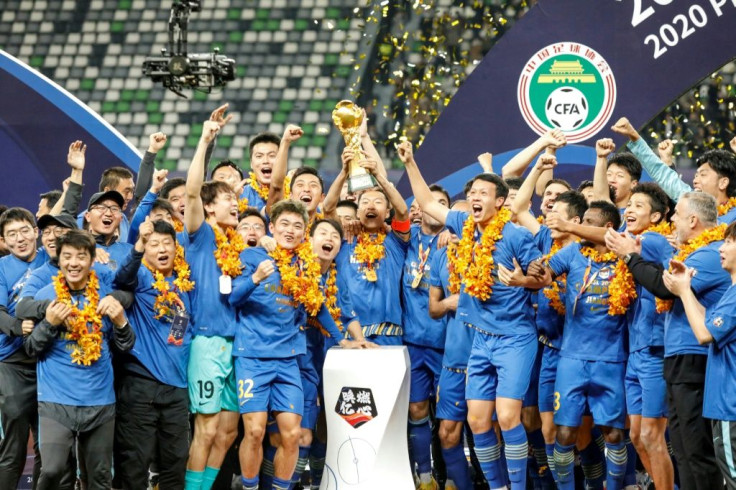 Jiangsu Suning celebrate beating Guangzhou Evergrande to win the Chinese Super League last month, but both clubs may have to change their names for next season