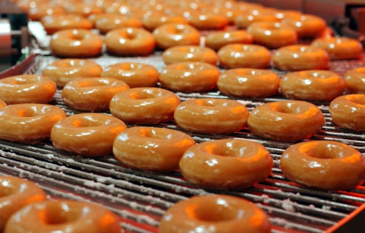 Krispy Kreme doughnuts go into production at the opening of the store at Harrods in London, October, 3, 2003.