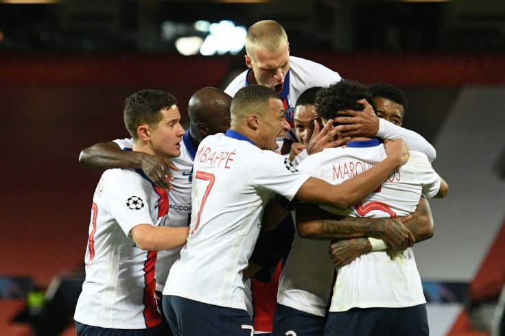 PSG players celebrate beating Manchester United in the Champions League. But they have allowed the chasing pack to close in on them in Ligue 1