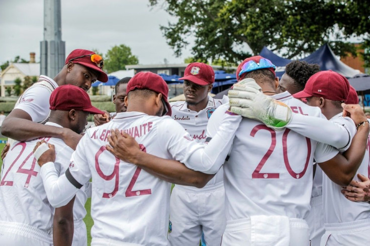 The West Indies players huddled before the start of the second day's play