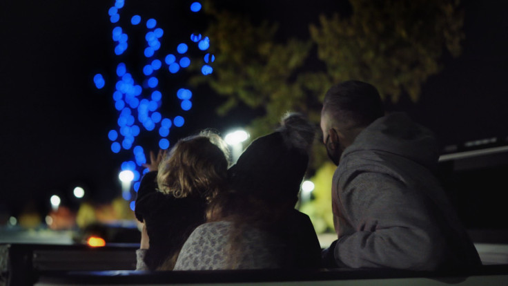 family-watching-drone-show