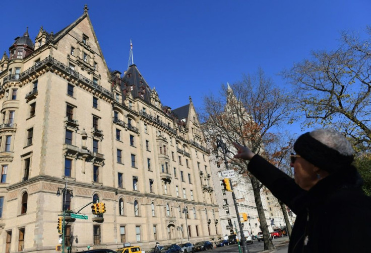 Susan Ryan, who conducts Beatles walking tours in New York, points to the penthouse in the Dakota apartment building, where John Lennon lived and his widow Yoko Ono still does
