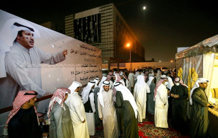Kuwaitis attend an electoral campaign meeting