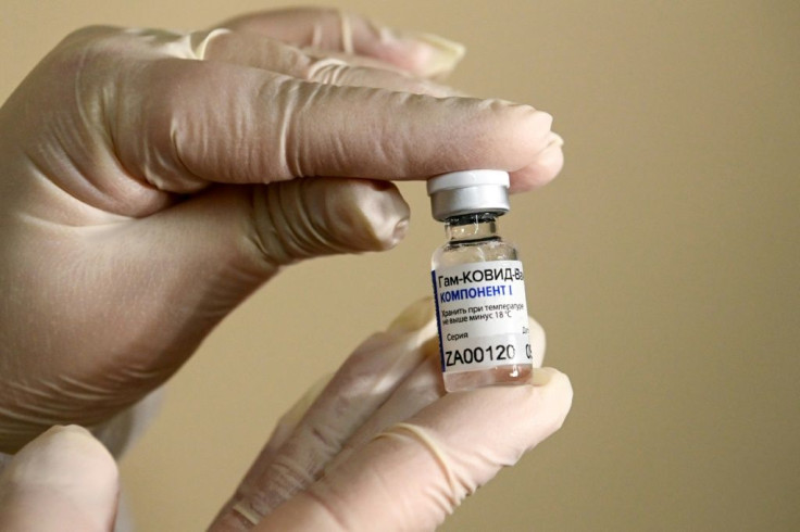 The mass vaccination rollout began as Russia set a new daily record for coronavirus infections