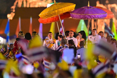 Thailand's King Maha Vajiralongkorn (C) greeted thousands of supporters in Bangkok on Saturday, at an event marking his late father's birthday
