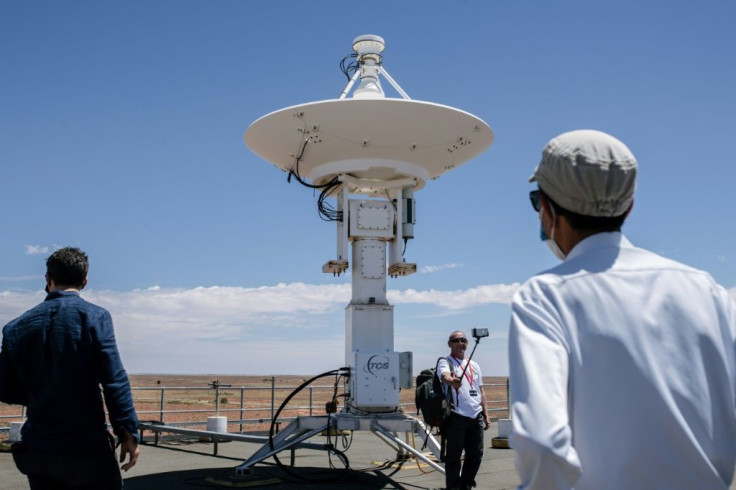 Japan Aerospace Exploration Agency (JAXA) officials and reporters tour the roof of the Royal Australian Air Force's  Woomera Range Complex in South Australia ahead of capsule's arrival