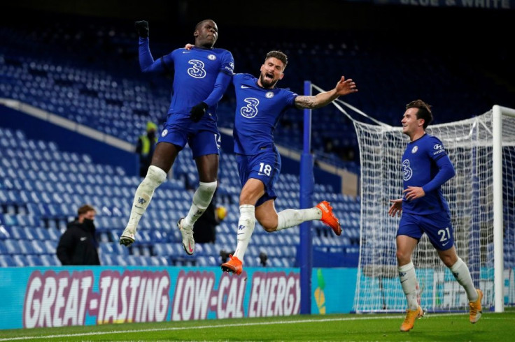 Flying high: Kurt Zouma (L) scored the winner as Chelsea went top of the Premier League