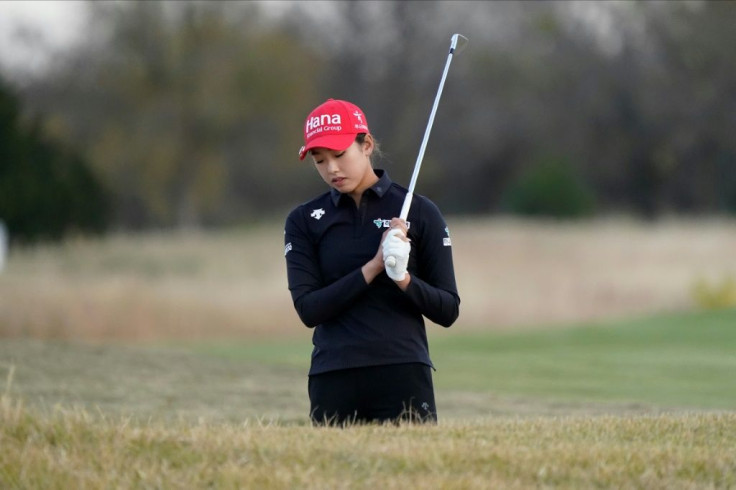 US teen Yealimi Noh looks down into a sand trap after her shot landed back in the bunker on the way to a double bogey on the 18th hole that dropped her into a share of the lead after three rounds of the LPGA Volunteers of America Championship
