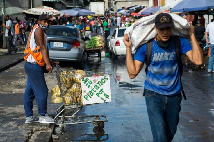 A man sells plantains in a market in Caracas, Venezuela on December 5, 2020 on the eve of legislative voting