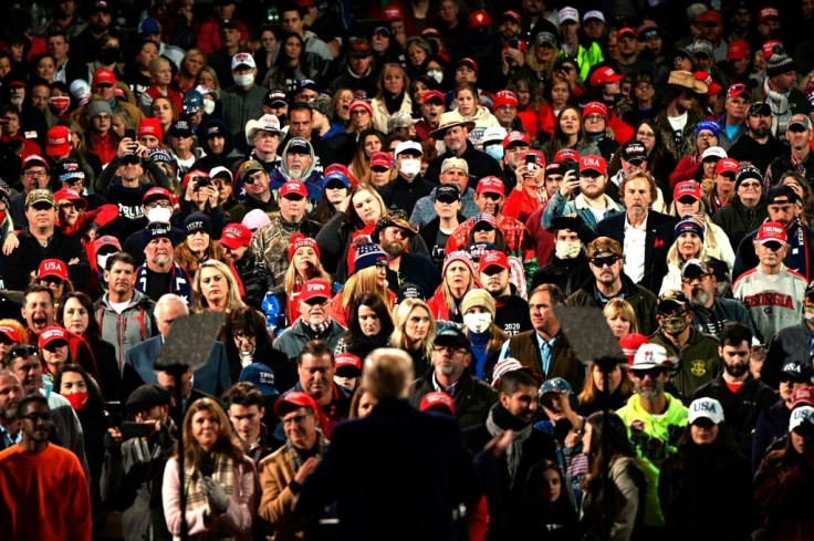 Few supporters wore masks when President Donald Trump held a rally in Georgia, where two run-off races will decide control of the Senate