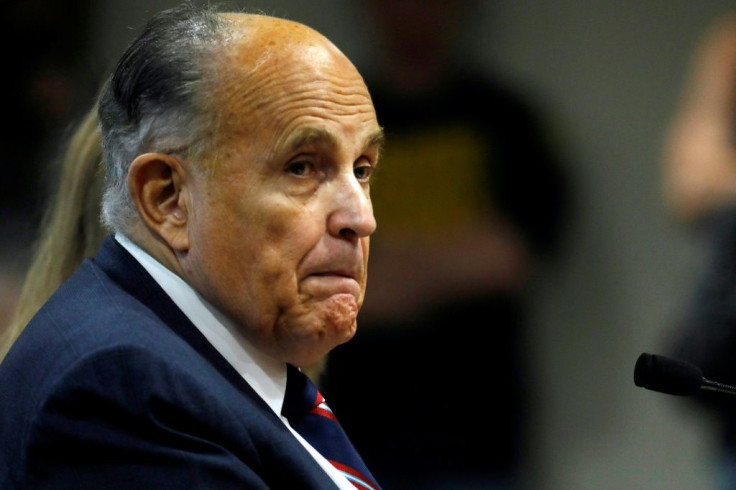 Rudy Giuliani, personal lawyer of US President Donald Trump, looks on during an appearance in Michigan