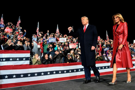 US President Donald Trump and his wife Melania Trump (pictured December 5, 2020 at a rally in Valdosta, Georgia) both contracted the coronavirus weeks before the November 3, 2020 presidential election