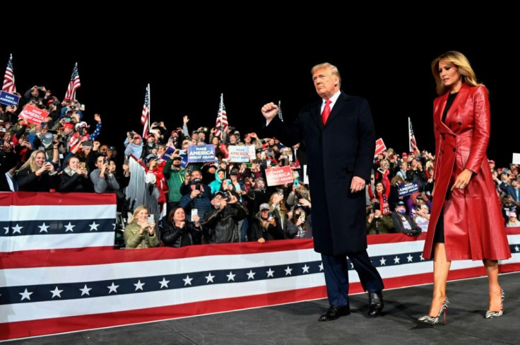 US President Donald Trump and his wife Melania Trump (pictured December 5, 2020 at a rally in Valdosta, Georgia) both contracted the coronavirus weeks before the November 3, 2020 presidential election